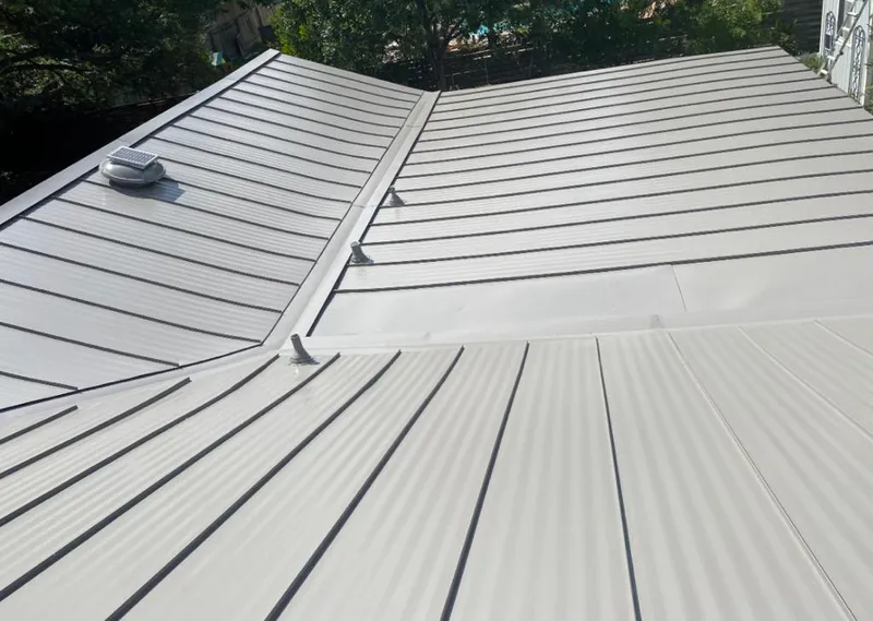 Solar attic fan installed on a metal roof for Roof Ventilation in Fort Hood